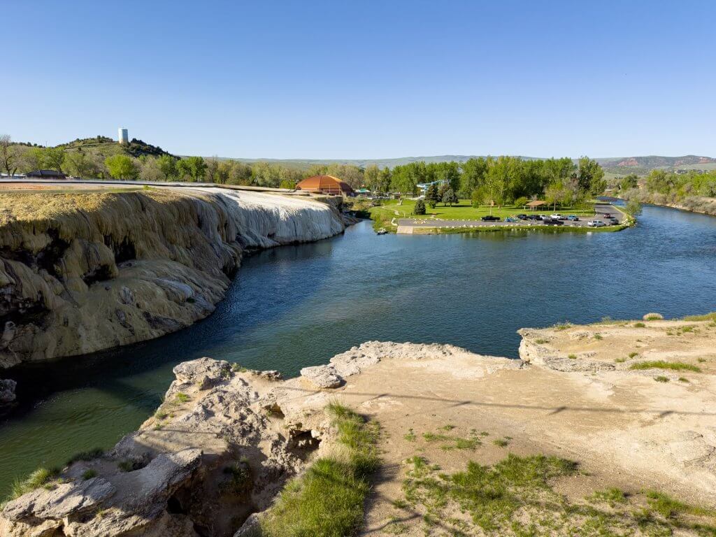 The Bighorn River through a landscape of rock formations and trees at Hot Springs State Park.