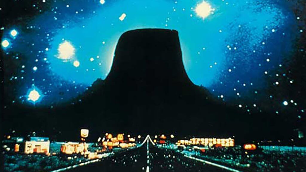 stary background of a dark road, a preview of close encounters of a third kind, a movie filmed at the Devils Tower in Wyoming