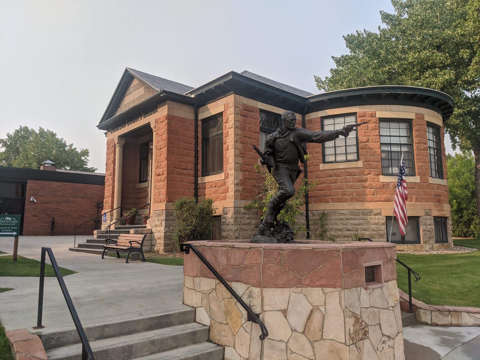 A statue stands before the Jim Gatchell Memorial Museum.