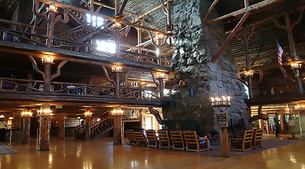 Inside of Old Faithful Inn with a wood and stone interior. It is considered a national historic landmark and holds some haunted tales.