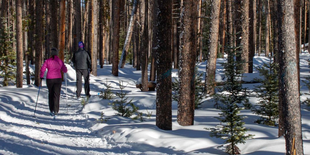 A couple enjoys winter in Saratoga, WY, a top skiing destination.