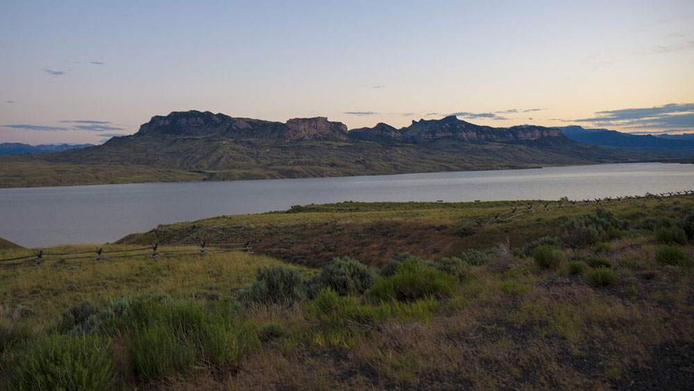 Water with mountains in the background at Buffalo Bill Reservoir in Wyoming