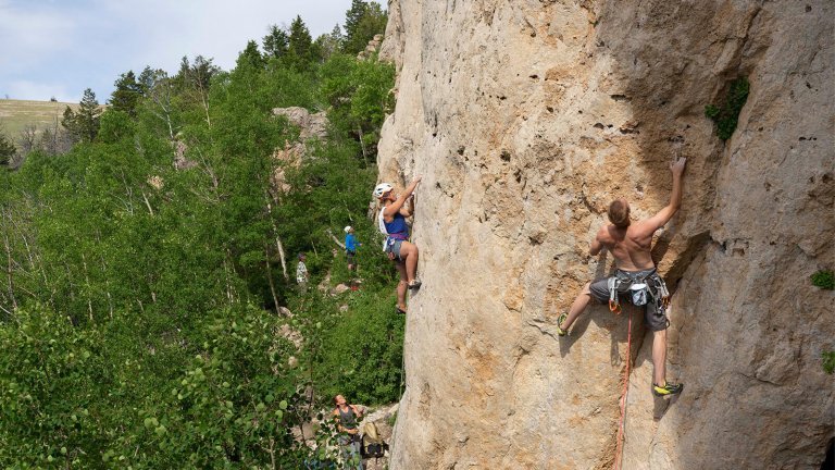 Climbers scaling rock