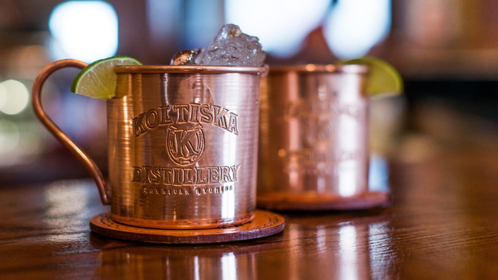 Craft beverage Moscow Mules in copper mugs with lime at Koltiska Distillery in Sheridan, WY.