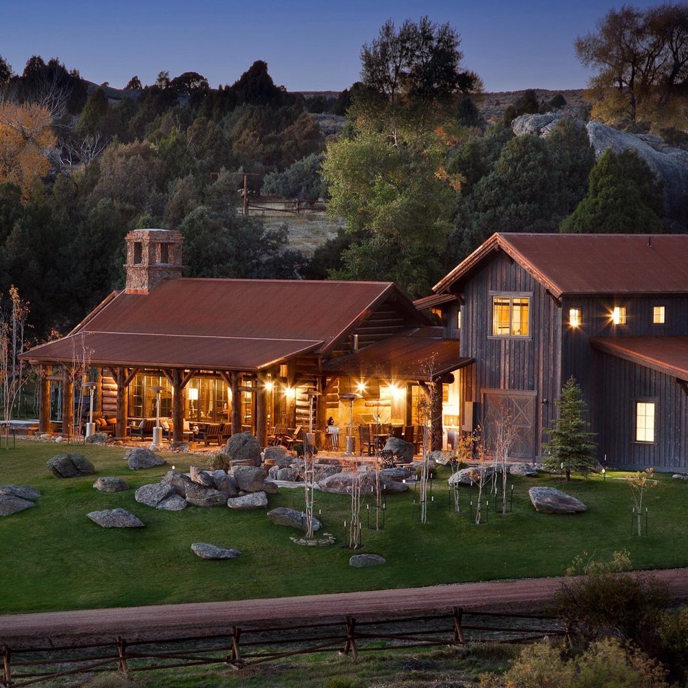 Outdoor area nestled in greenery of Brush Creek Ranch, an all inclusive luxury resort that offers wedding packages.