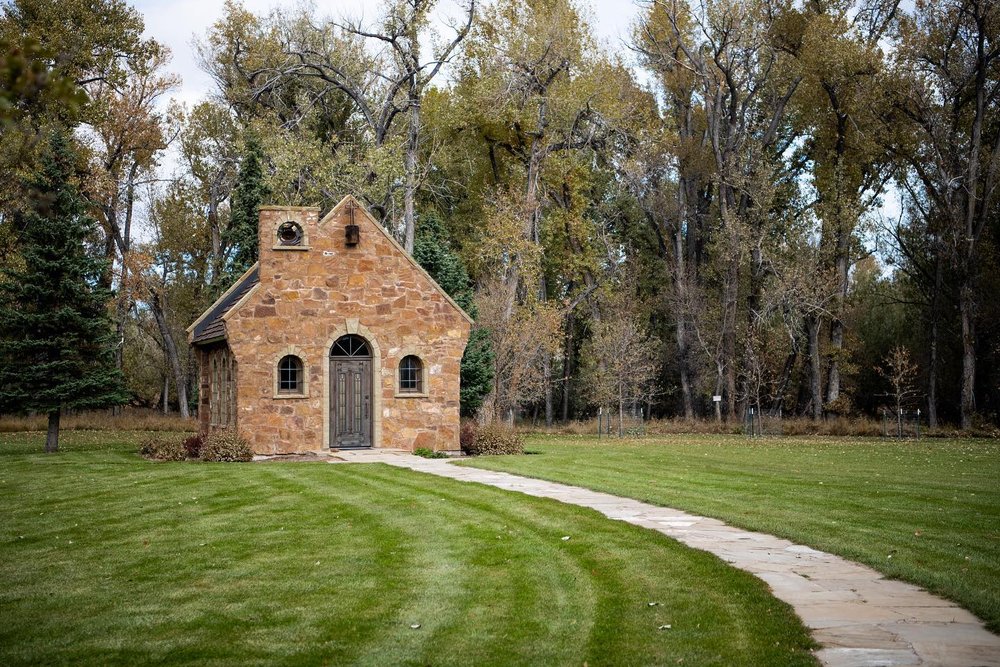 Stony exterior of the Ucross Chapel, a quaint wedding venue option in Wyoming.