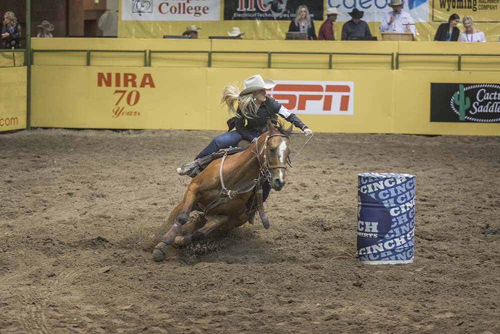A cowgirl riding a horse during Barrel Racing at a Family Rodeo.