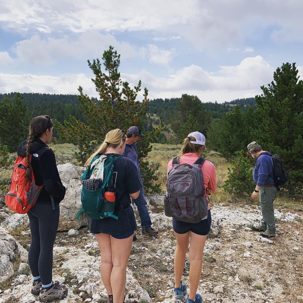 A group of hikers in Eadsville, a ghost town in Wyoming. 