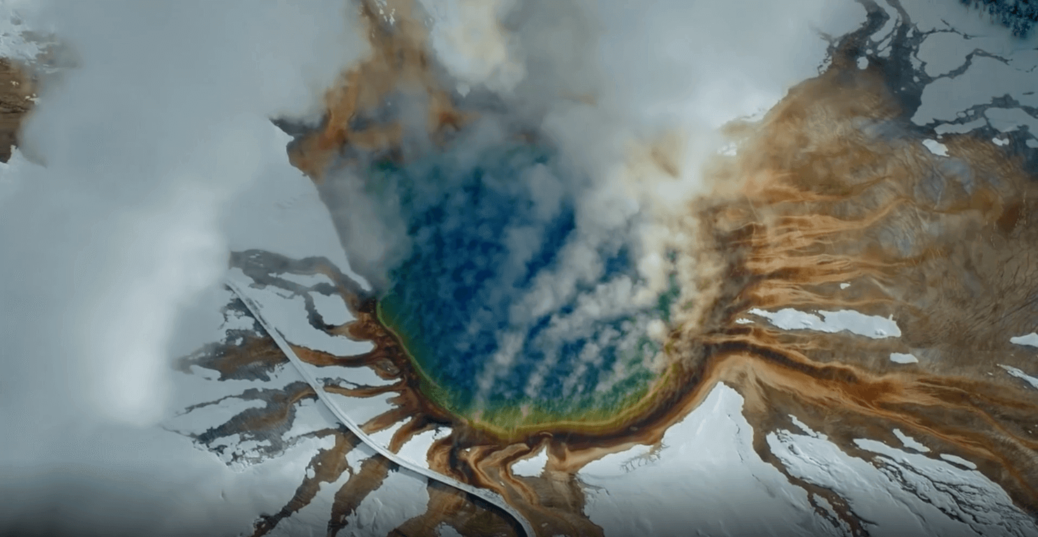 aerial view of grand prismatic hot spring in winter