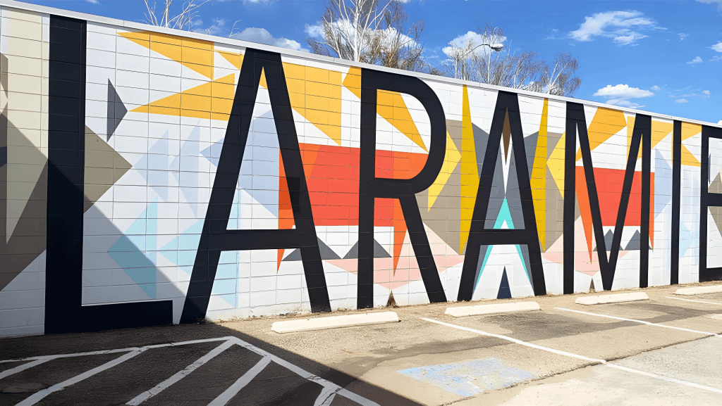 This colorful mural in Laramie, showcasing the vibrant art scene and something to do in downtown.