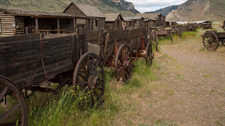 A wagon trail winding through Old Trail Town, a top thing to do in Cody, WY.