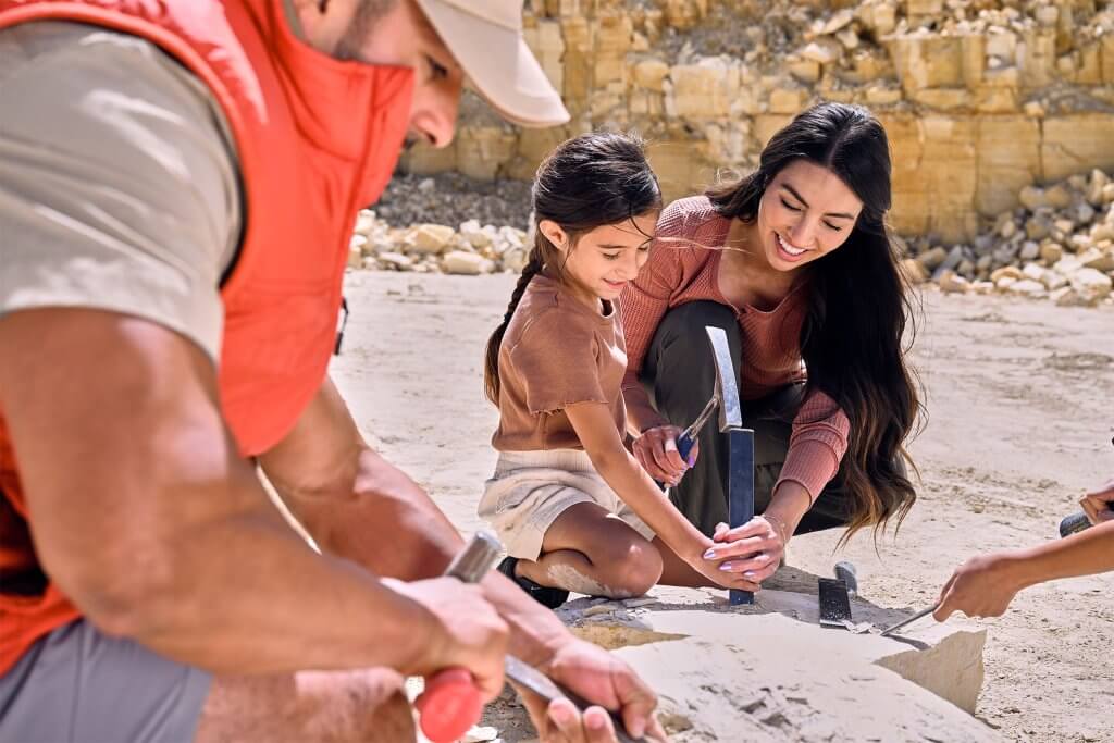 A family digging for fossils at the American Fossil Quarry.