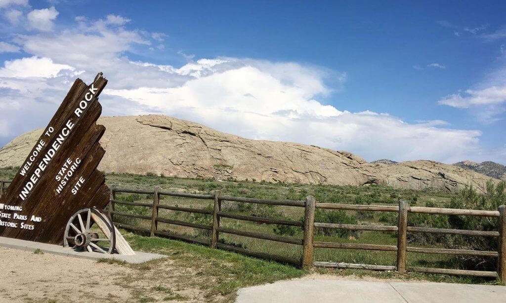 The famous national landmark overlooks the landscape at the Independence Rock State Historic Site in Natrona County, Wyoming.The famous landmark made of large granite rock - U.S. National Historic Landmark on the 