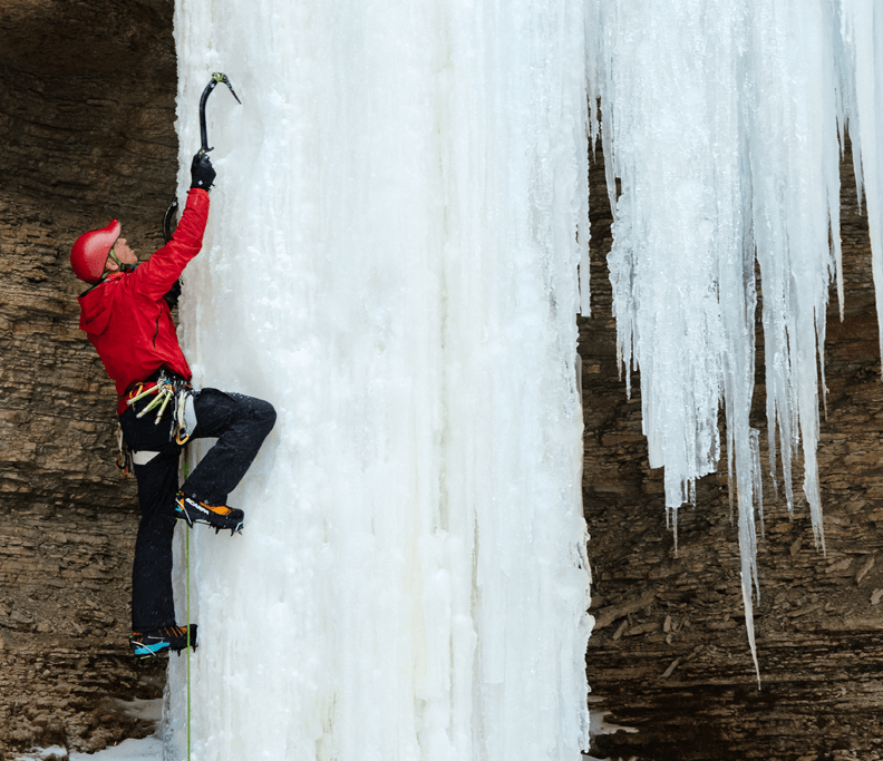 Aaron Mulkey climbing a frozen waterfall