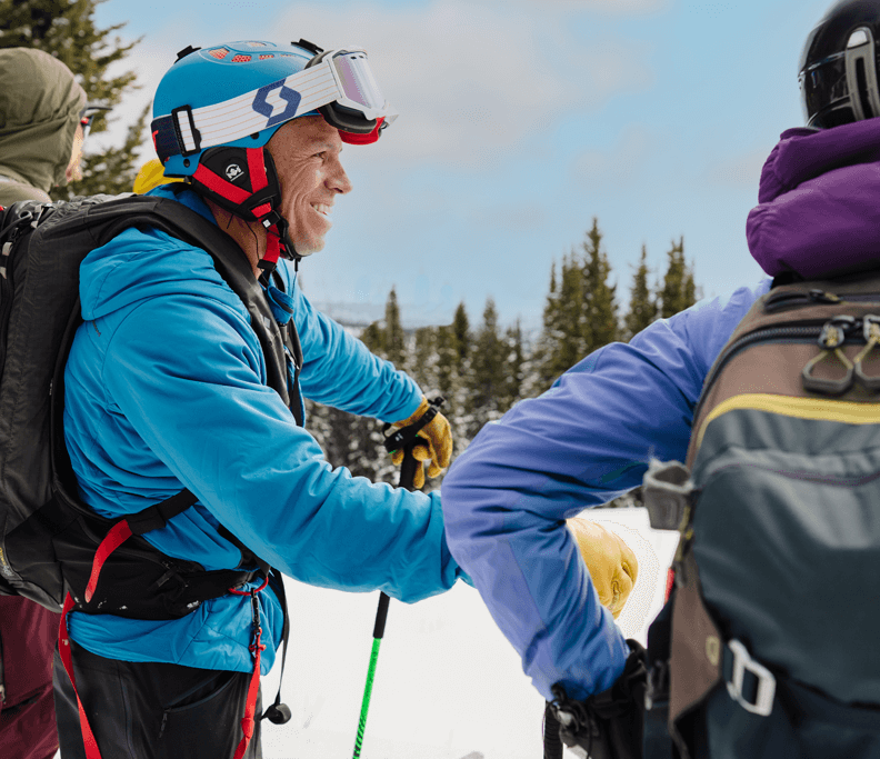 Aaron Mulkey and aa group of people on snow skis